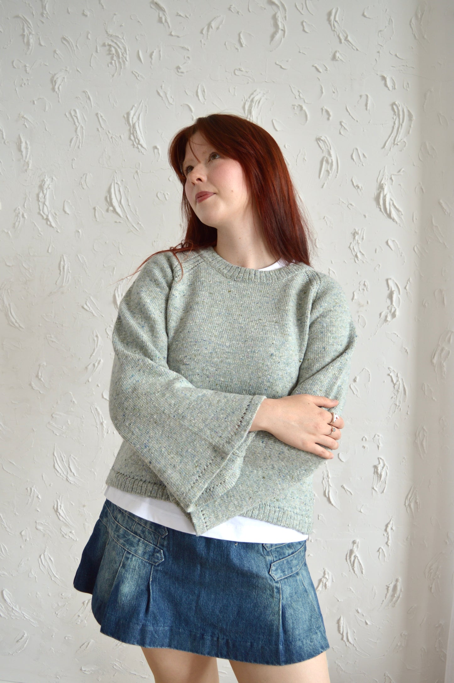 Front view of The Bell Sweater in light grey