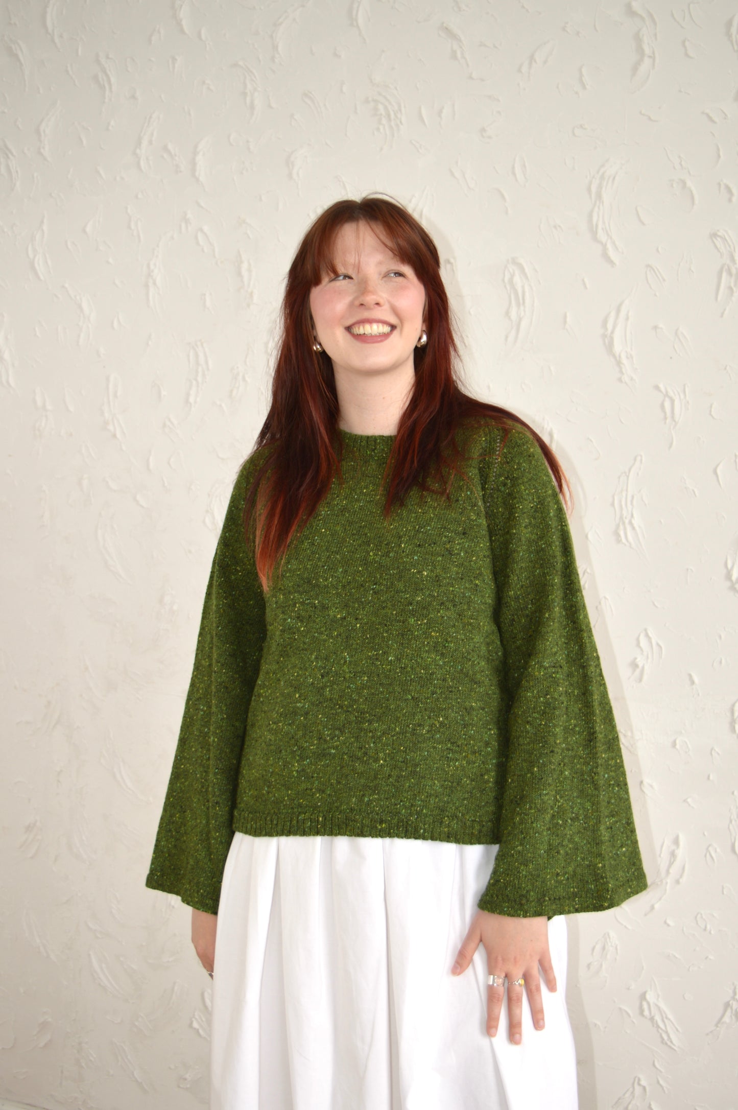 Model wearing the Bell Sweater in green