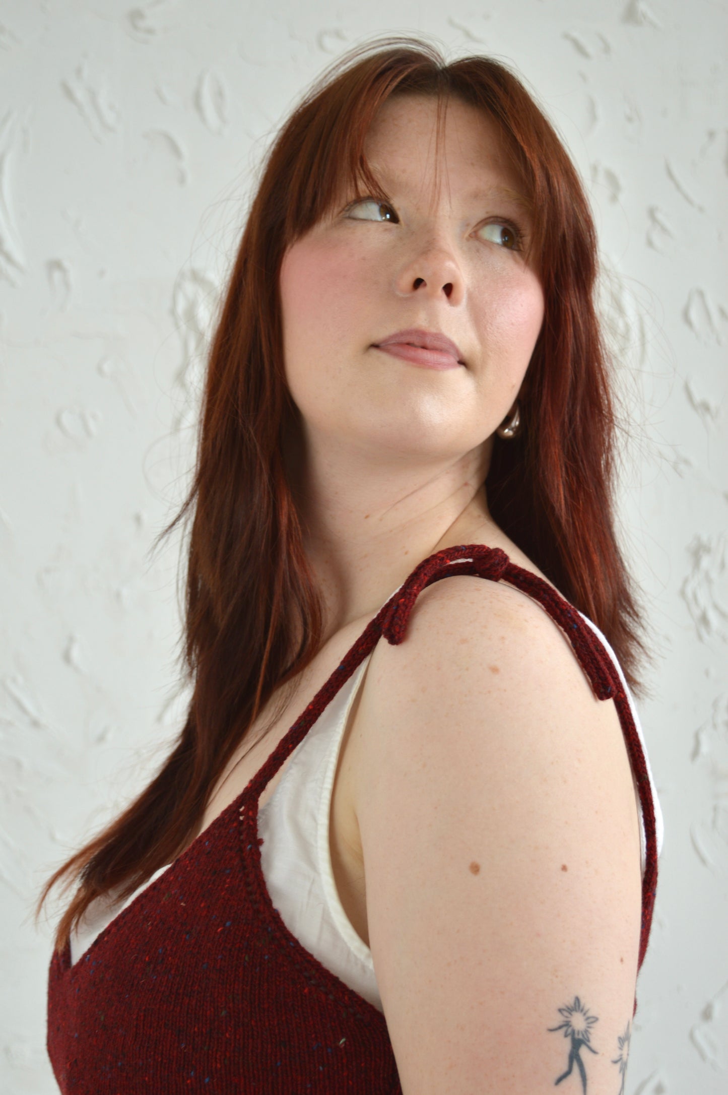 Close up view of Tie Cami straps and model looking over shoulder