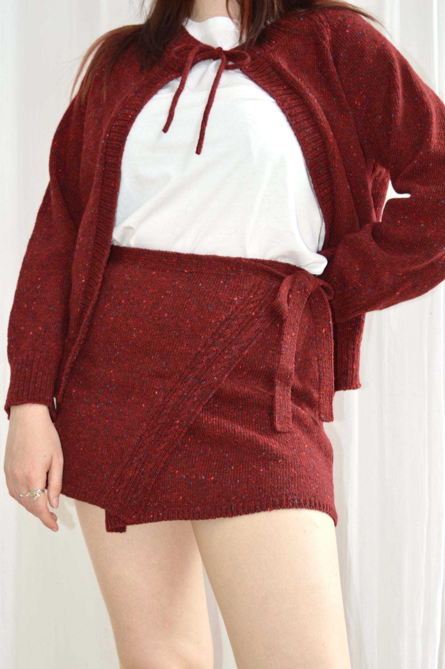 Close up shot of model wearing The Wrap Skirt in red