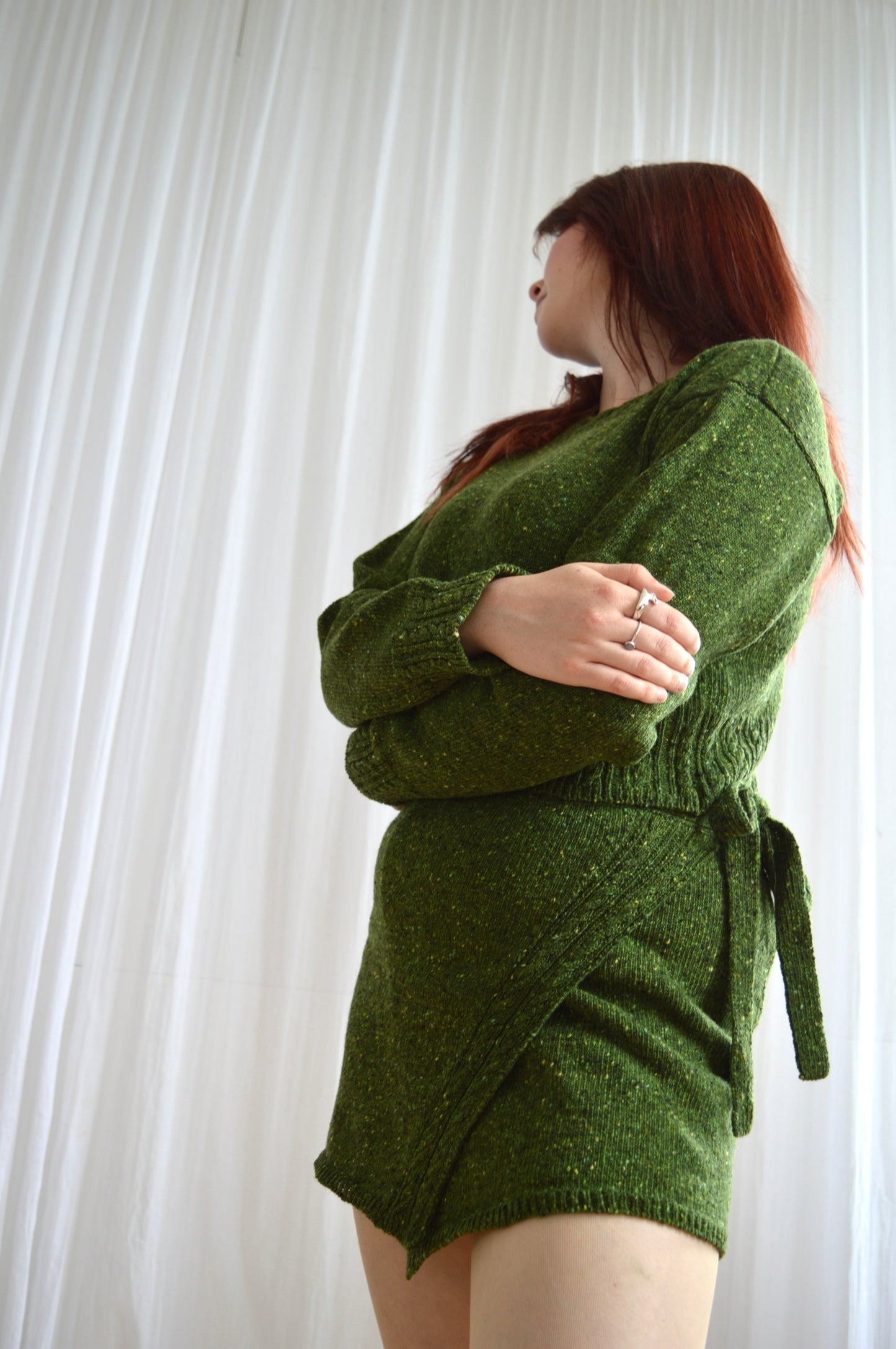 Low angle shot of model wearing The Wrap Skirt in green