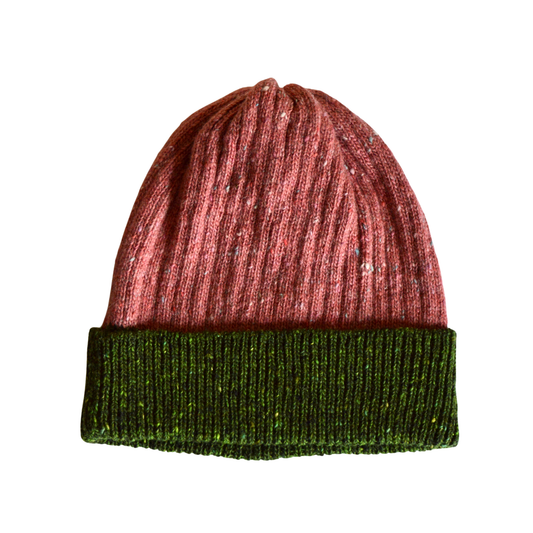 Two-tone pink and green beanie hat on a white background