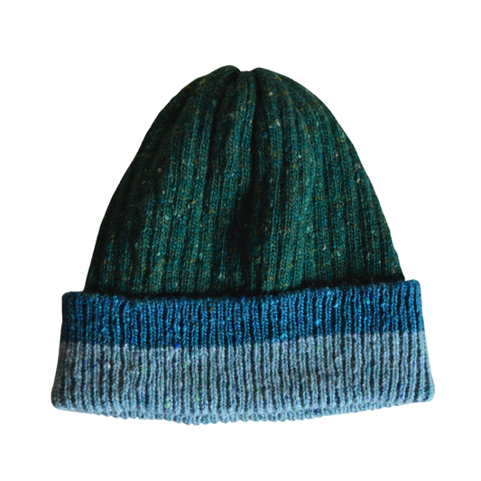 Green body and light and dark blue rib beanie on a white background