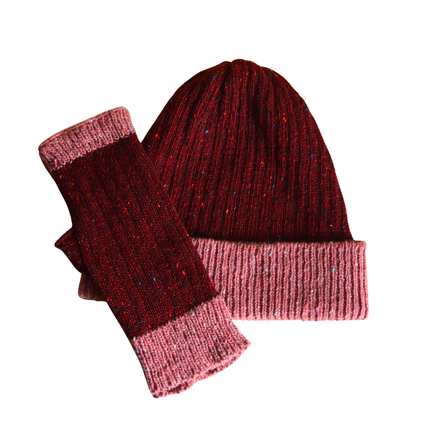 Red and pink beanie and fingerless gloves set on a white background
